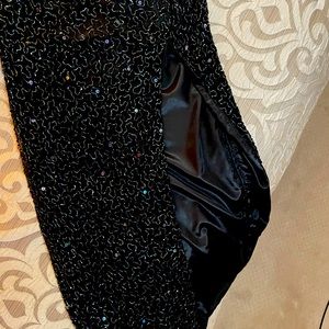 Black all sequin size small. Halter with front slit. Great condition